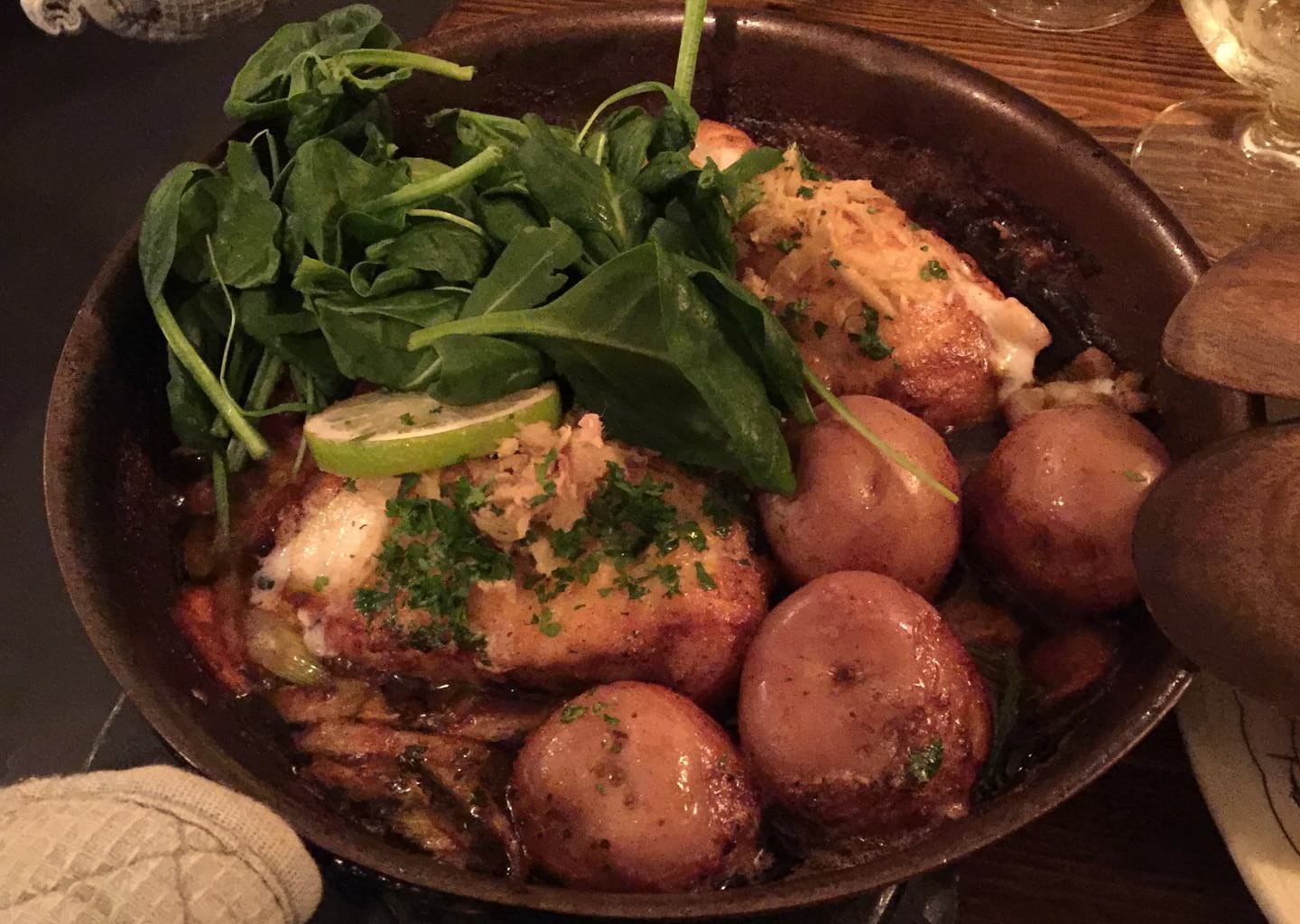 The fish is served in a pan with all the condiments