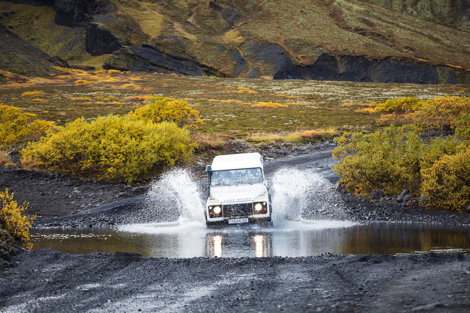 Adventurous river crossing by a white SupetJeep in Landmannalaugar, Iceland 